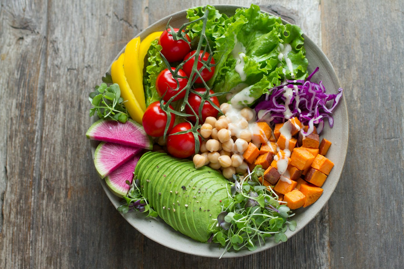 Colorful vegetables, greens and chickpeas in a bowl